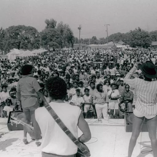 Band performing in front of a crowd at the county fair